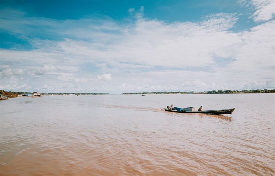 Small boat on the wide Amazon