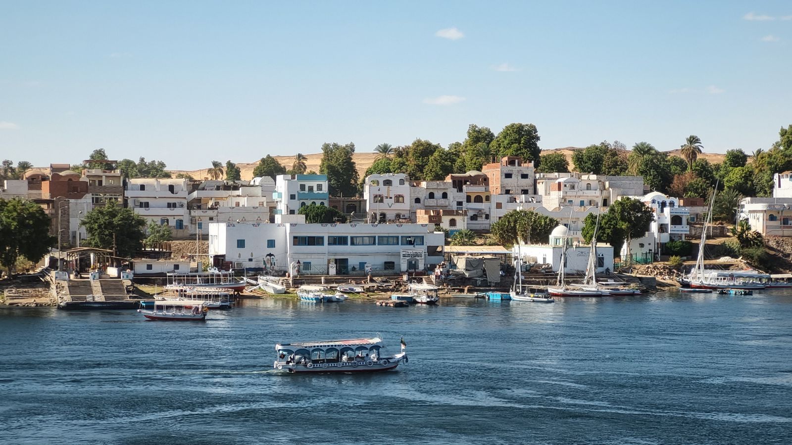Boats on the Nile in front of the Aswan riverside, where visitors ask are Nile river cruises safe
